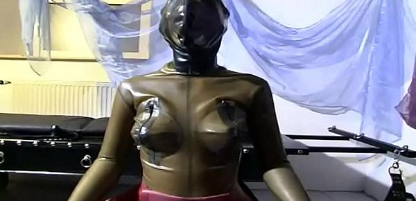  Girl in latex is an object in the hands of her master